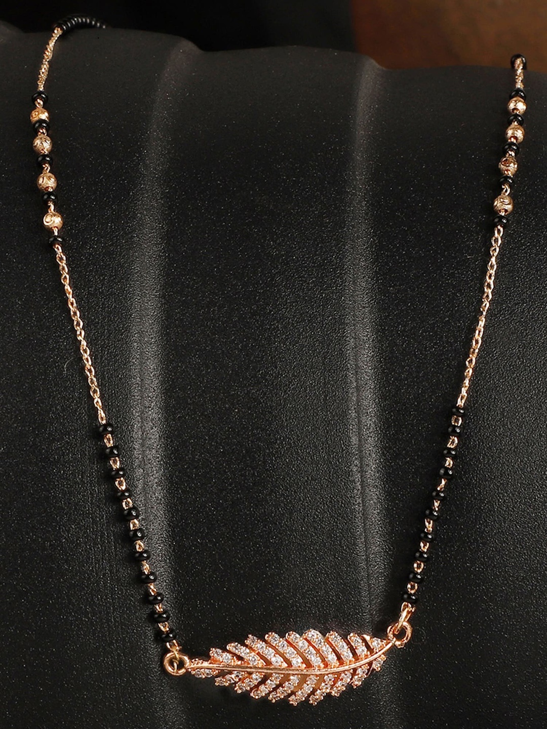 

ANIKAS CREATION Gold-Plated Black AD-studded Beaded Mangalsutra