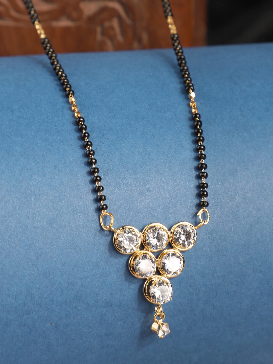 

ANIKAS CREATION Gold-Plated Black & White Beaded Stone-Studded Traditional Mangalsutra