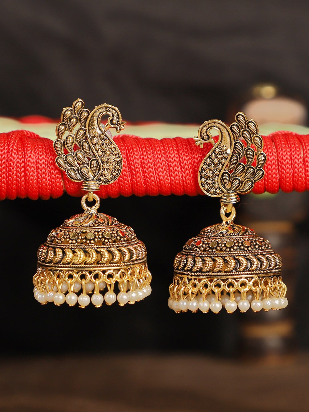 

ANIKAS CREATION Gold-Plated Antique Peacock Shaped Jhumkas