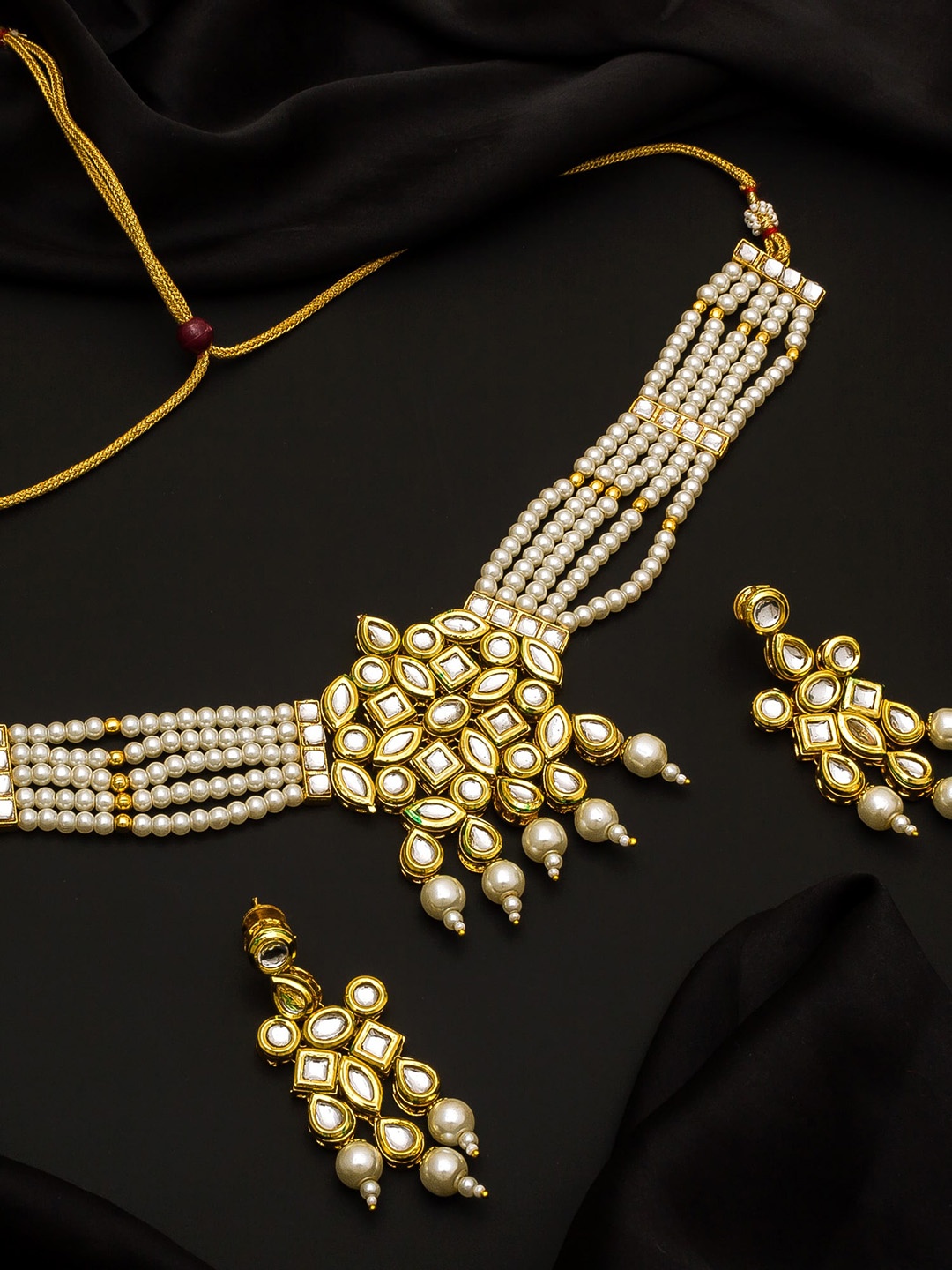 

Aadita Gold-Plated White Kundan Studded Beaded Handcrafted Jewellery Set
