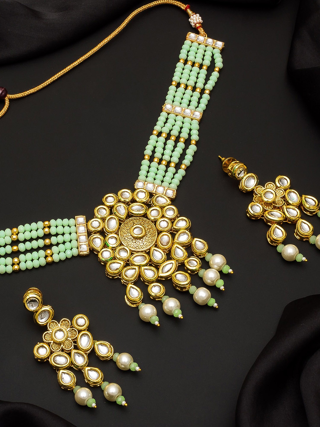 

aadita Gold-Plated White & Green Kundan-Studded Beaded Handcrafted Jewellery Set