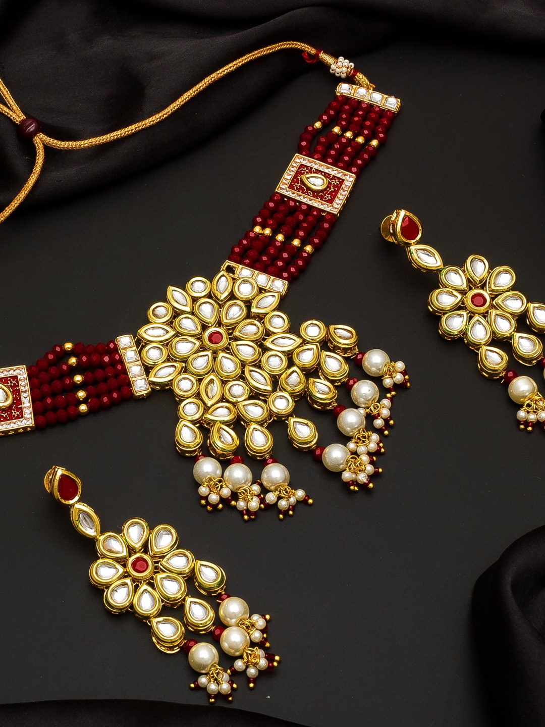 

aadita Gold-Plated & Maroon Kundan-Studded Beaded Jewellery Set