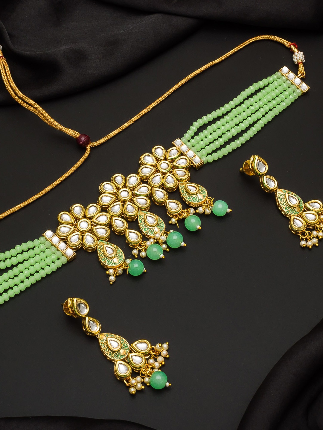 

Aadita Gold-Toned & Green Kundan Studded Beaded Handcrafted Jewellery Set