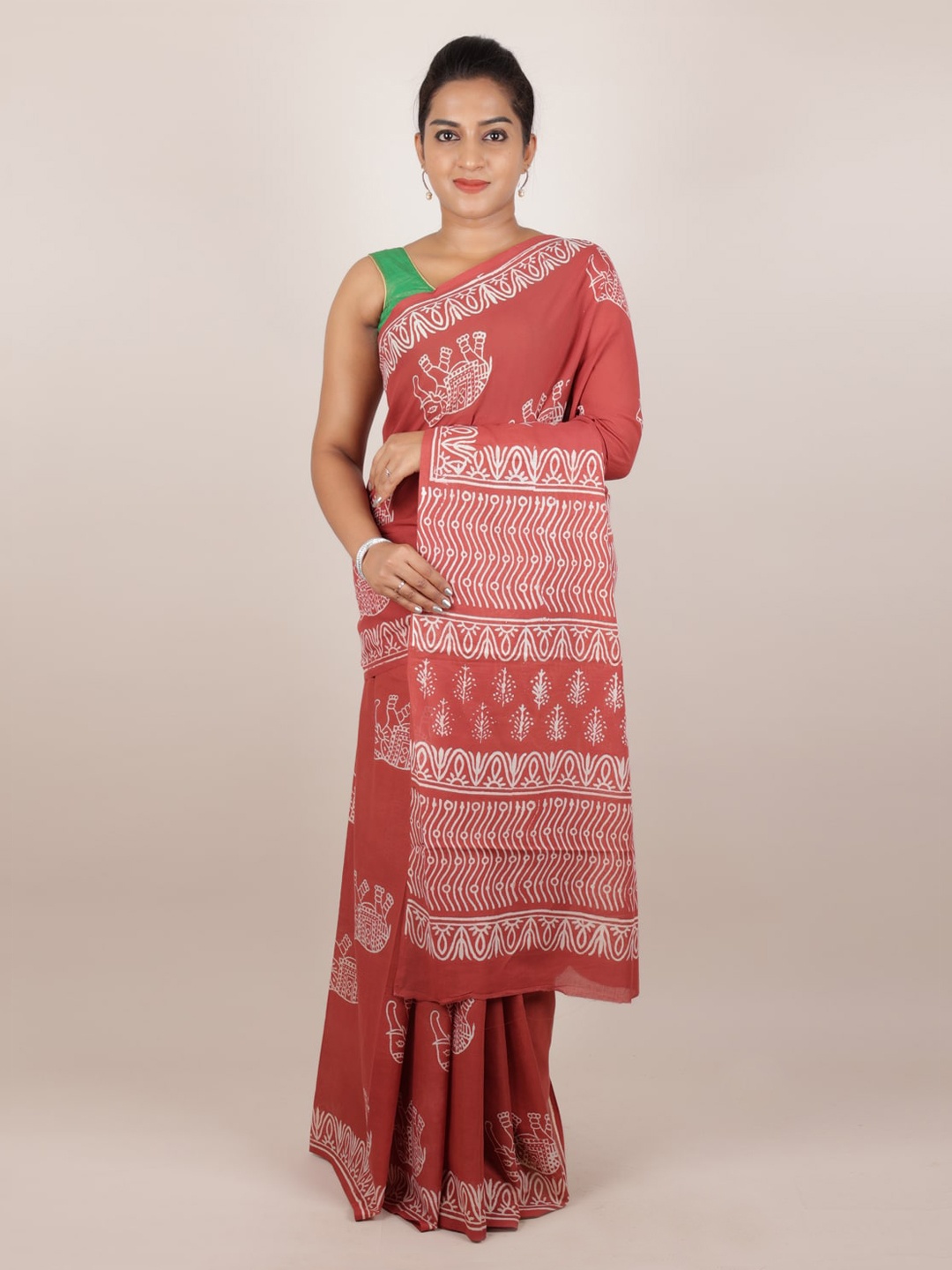 

Pothys Rust Printed Cotton Blend Saree