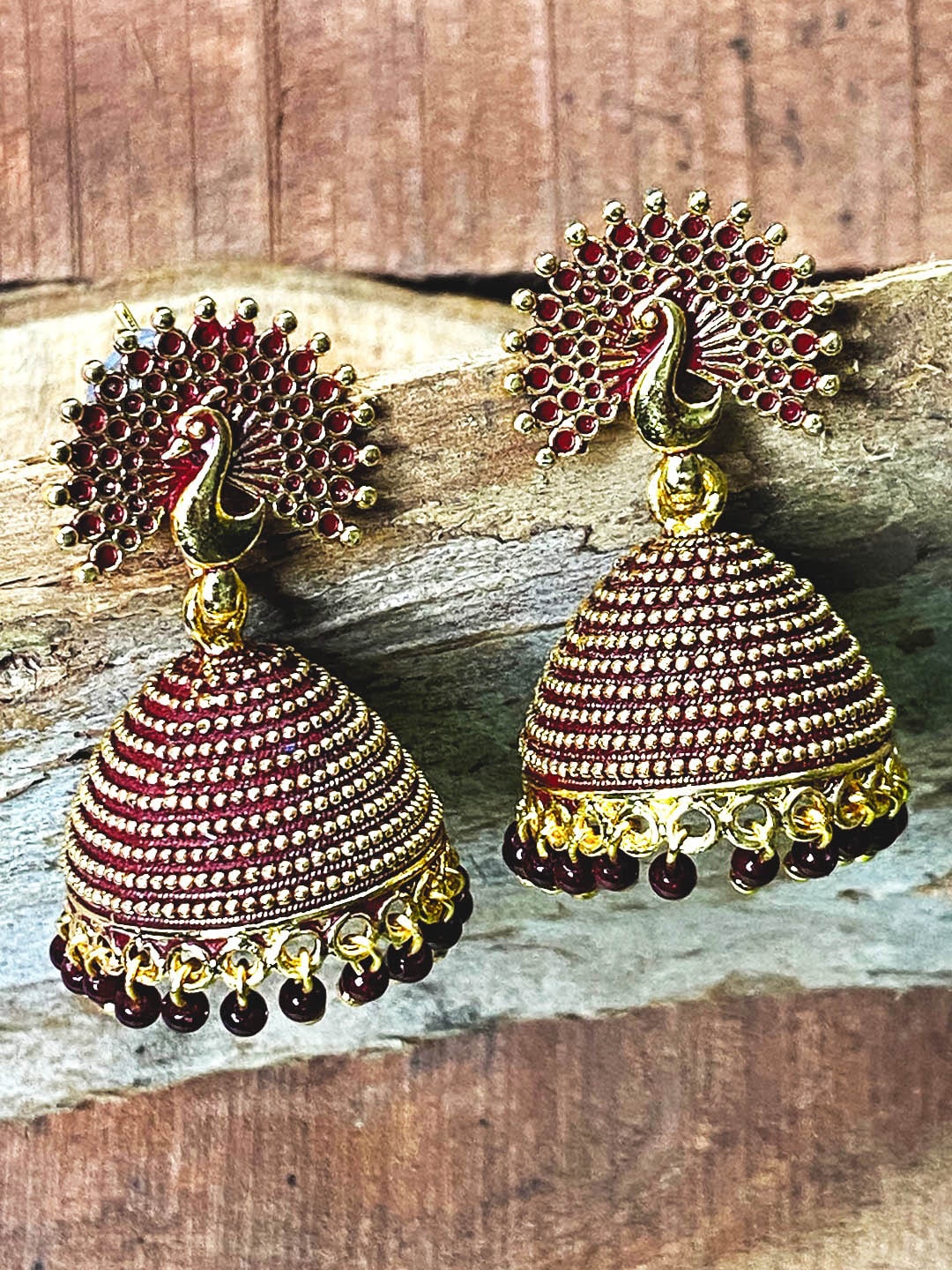 

ANIKAS CREATION Maroon & Gold-Plated Antique Dome Shaped Jhumkas