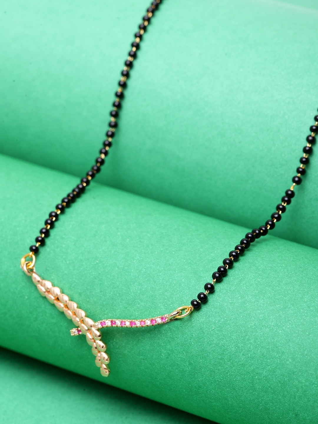 

ANIKAS CREATION Black & Pink Gold-Plated Stone Studded & Beaded Mangalsutra