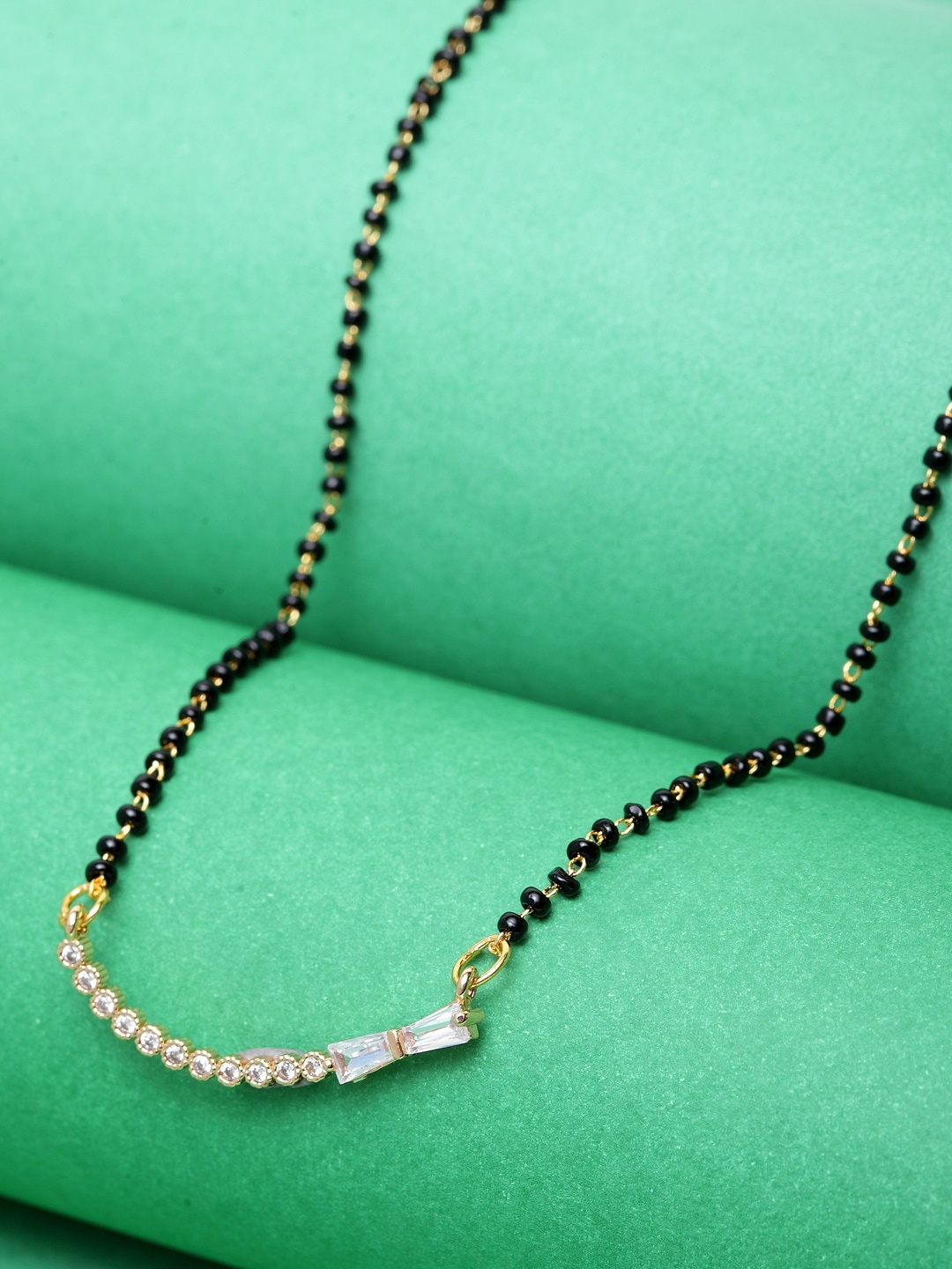 

ANIKAS CREATION Gold-Plated & Black Beaded & AD-Studded Mangalsutra