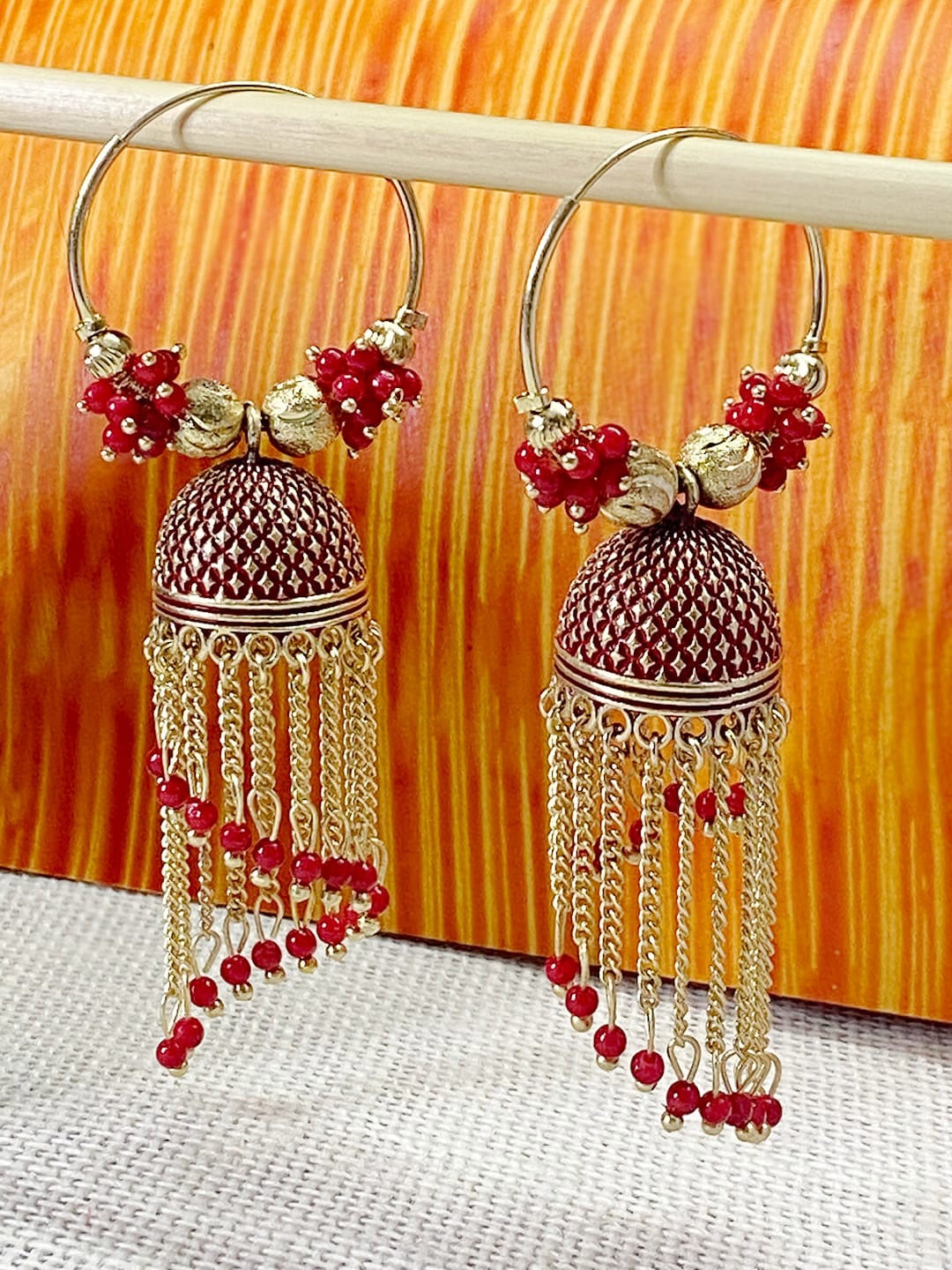 ANIKAS CREATION Red & Gold-Plated Antique Dome Shaped Jhumkas
