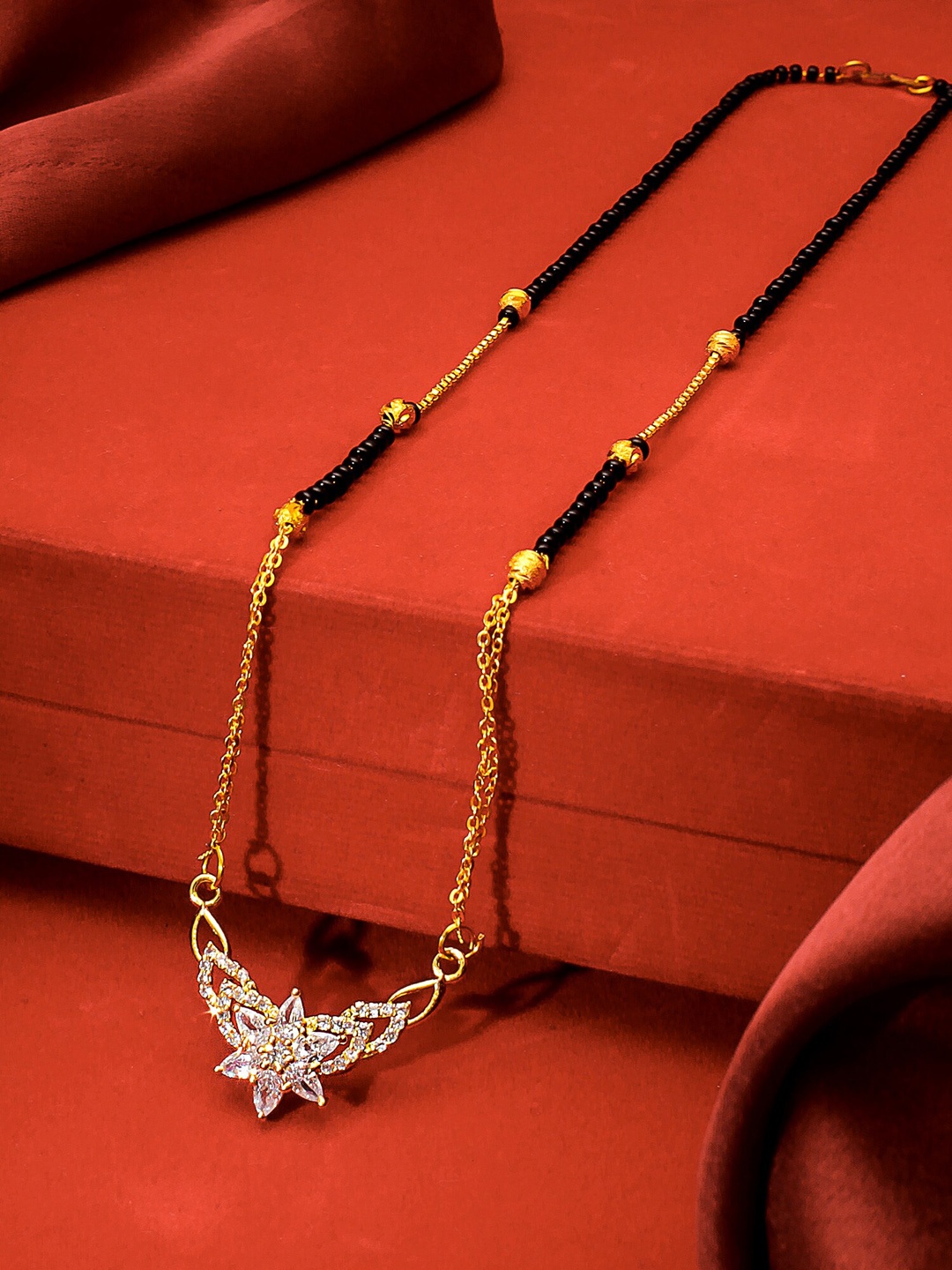 

aadita Gold-Plated Black & White AD-Studded & Beaded Mangalsutra