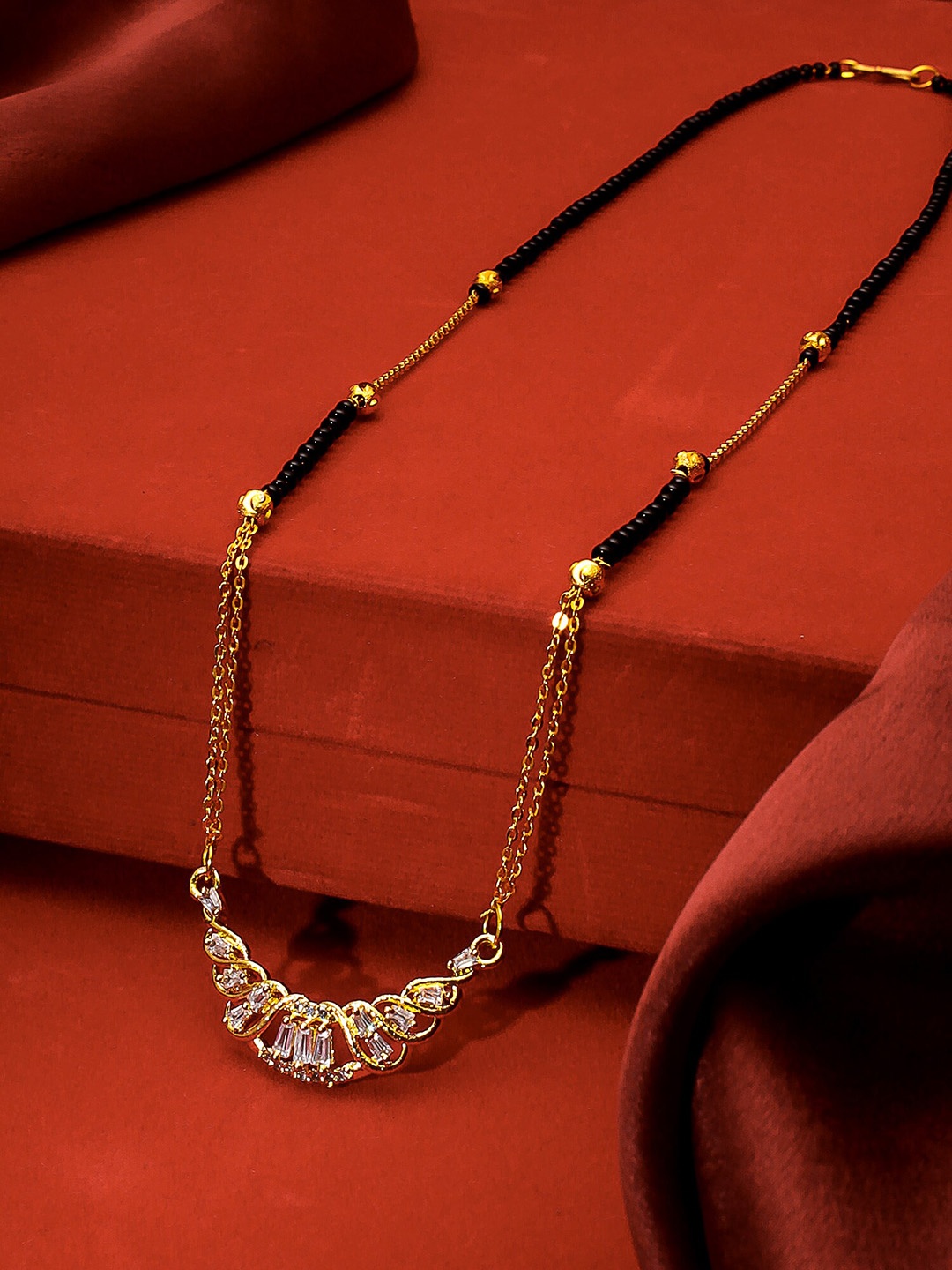 

aadita Gold-Plated Black & White AD-Studded & Beaded Mangalsutra