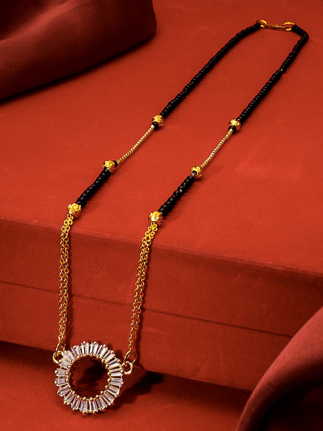 

aadita Gold-Plated Black & White AD-Studded & Beaded Mangalsutra