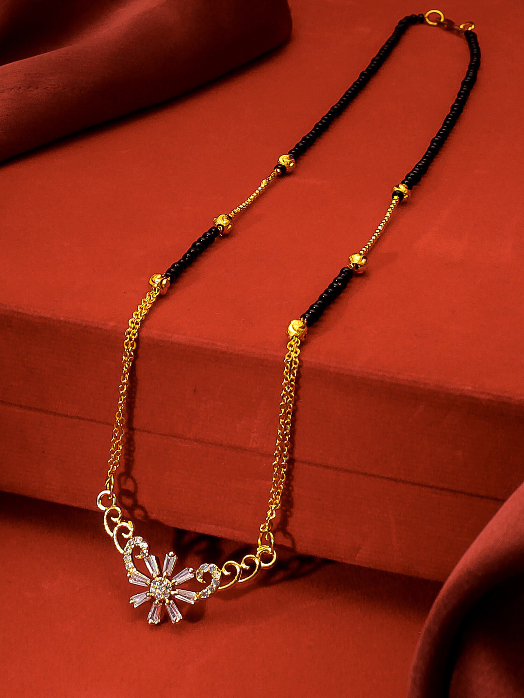 

aadita Gold-Plated Black & White AD-Studded Beaded Mangalsutra