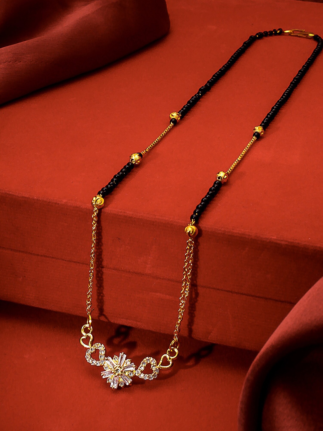 

aadita Gold-Plated Black & White American Diamond Studded & Beaded Mangalsutra