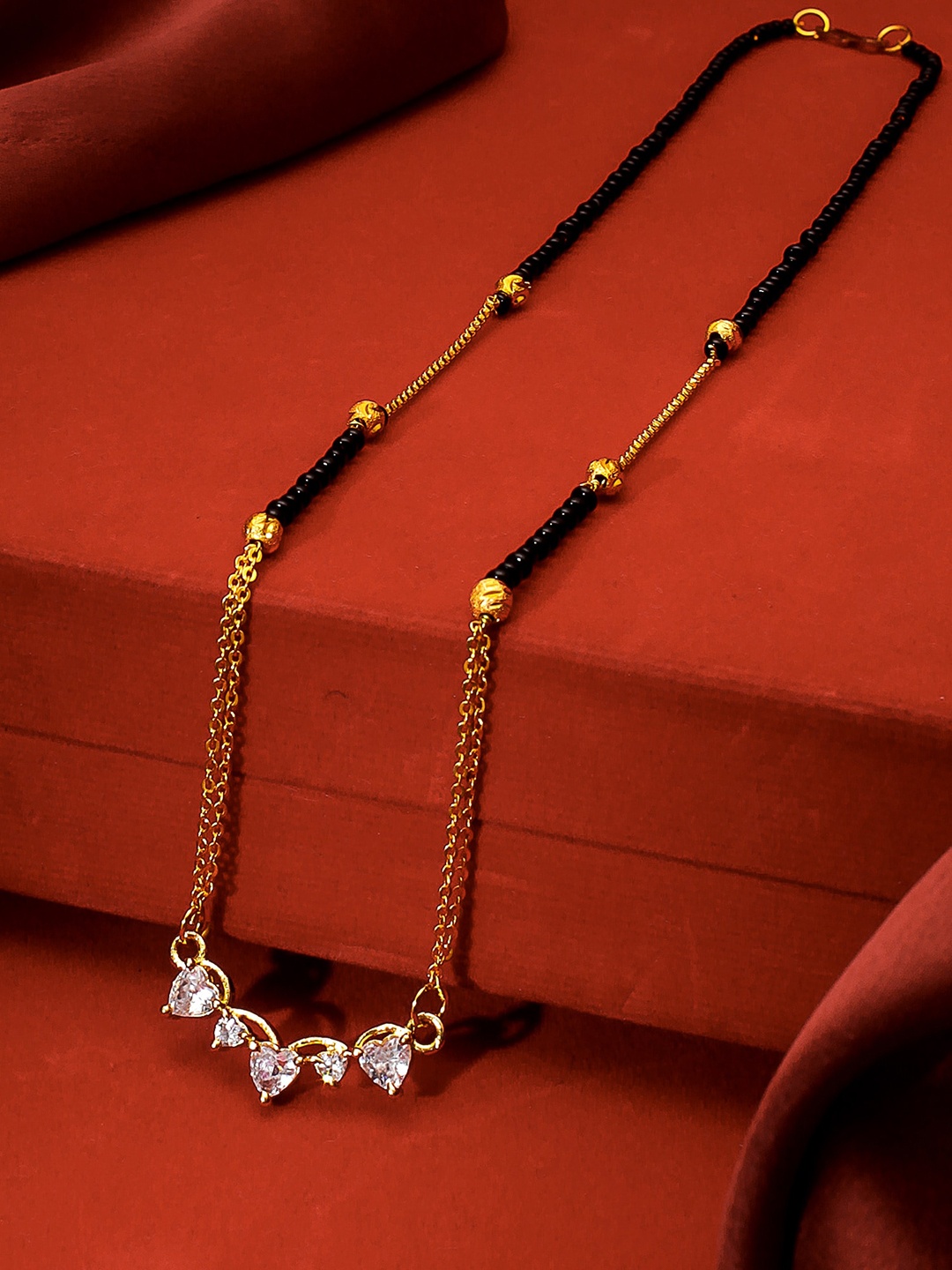 

aadita Gold-Plated Black & White AD-Studded & Beaded Mangalsutra
