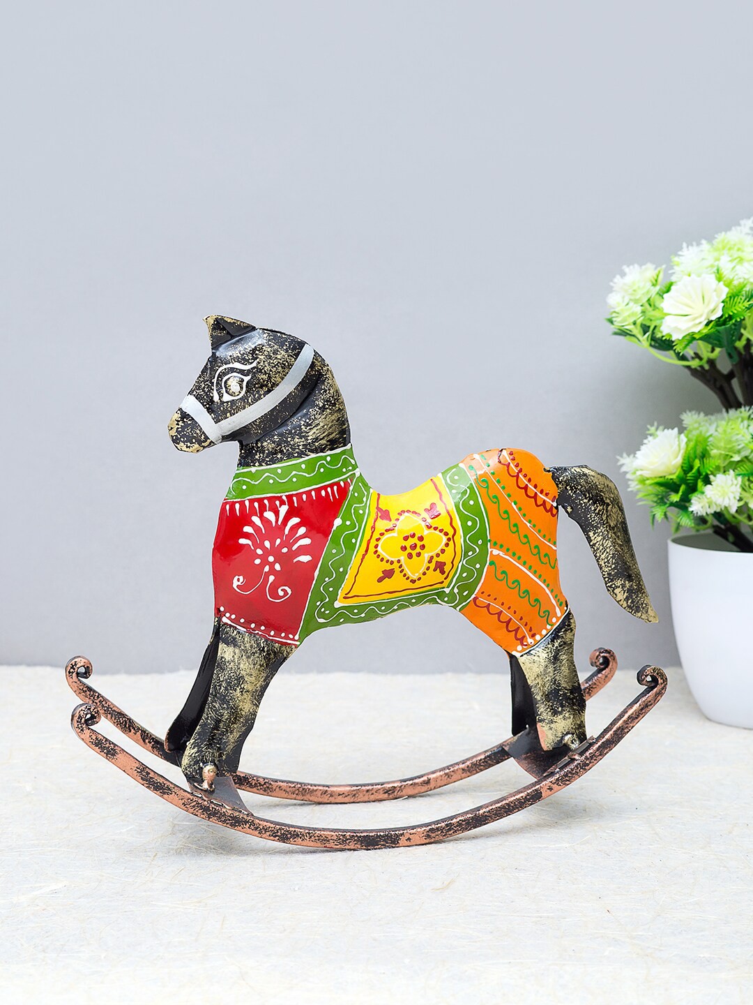 

Golden Peacock Black & Red Handcrafted Metal Rocking Horse Showpiece