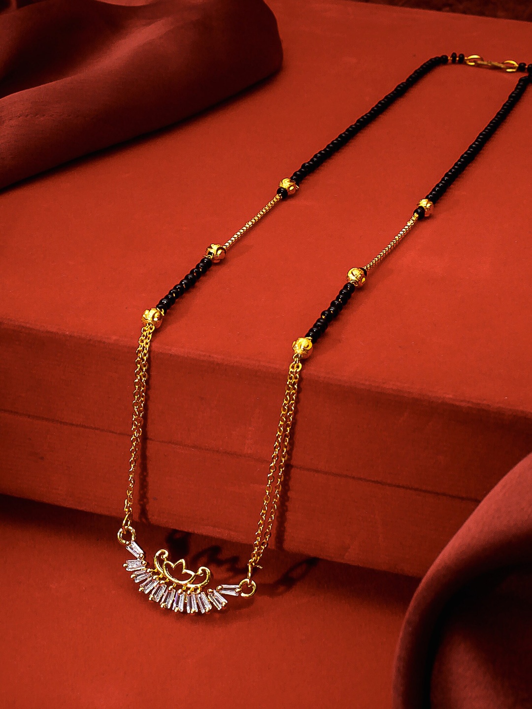 

aadita Gold-Plated Black & White AD-Studded & Beaded Mangalsutra