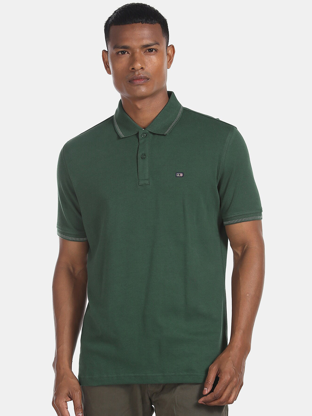

Arrow Sport Men Green Solid Polo Collar T-shirt