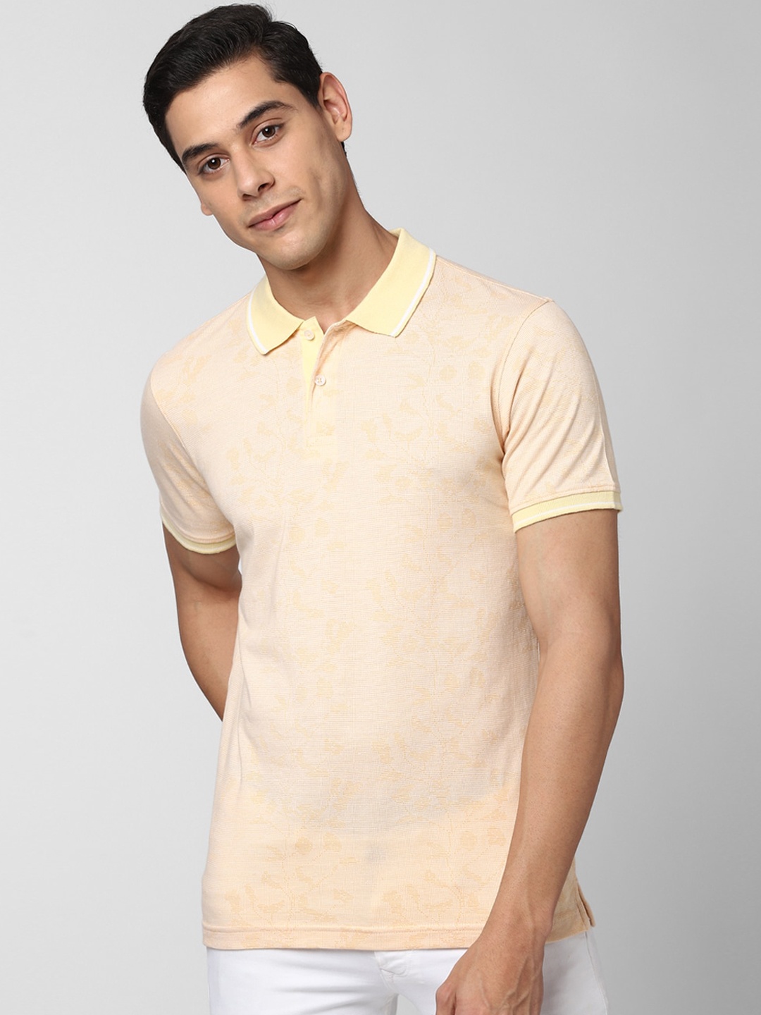 

Peter England Casuals Men Peach-Coloured Floral Self Design Polo Collar T-shirt