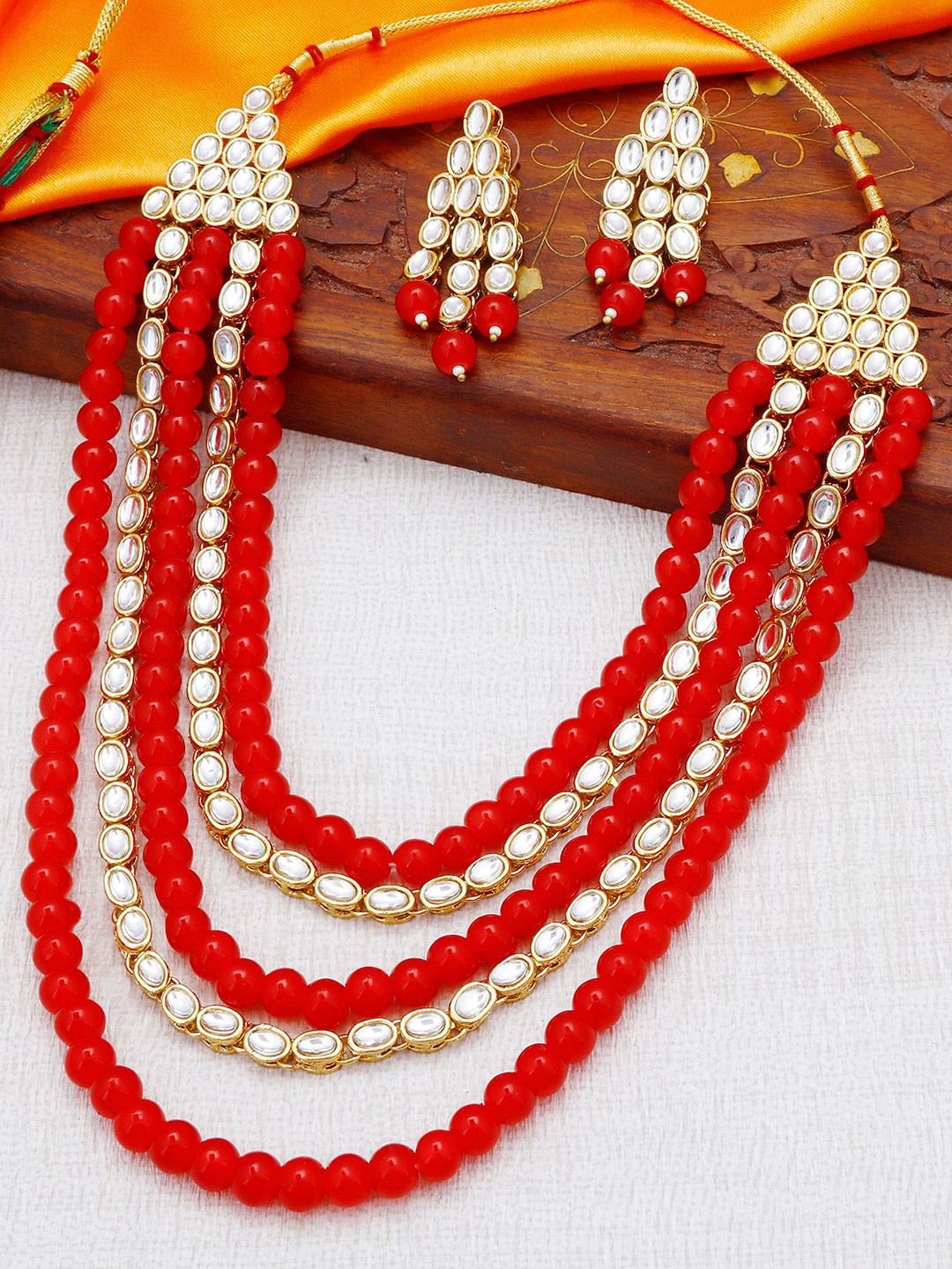 

Sukkhi Gold-Plated & Red Kundan-Studded & Beaded Layered Jewellery Set