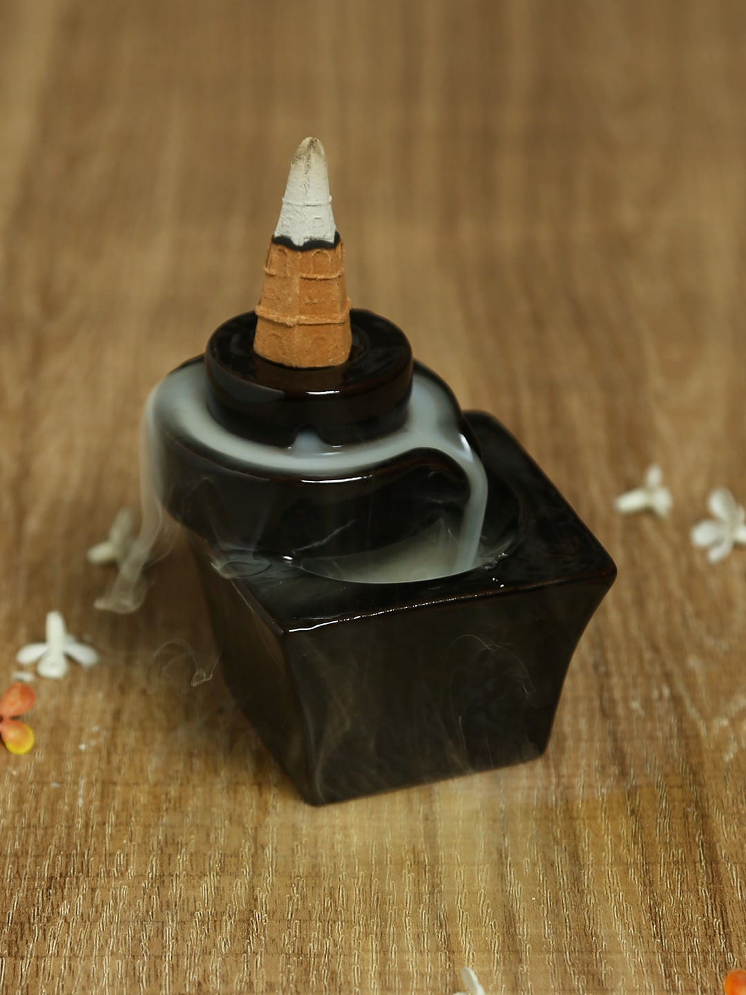 

Aapno Rajasthan Black Solid Resin Smoke Fountain with Built-In Backflow Incense Cone