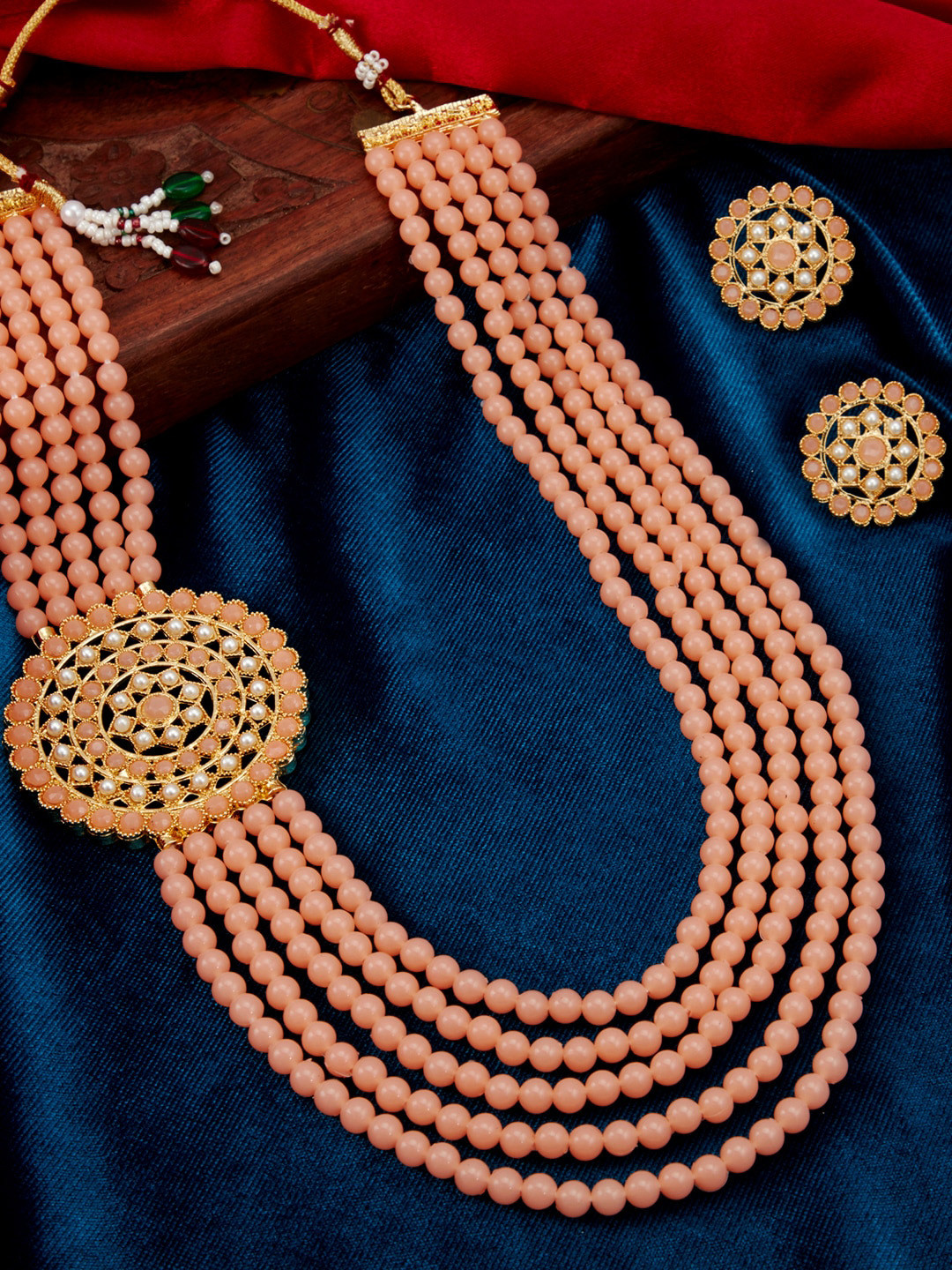 

Sukkhi Gold-Plated Peach-Coloured & White Pearl-Studded Layered Sustainable Jewellery Set
