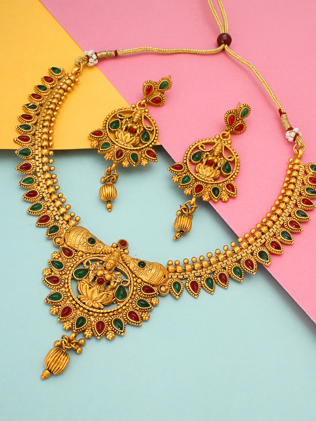

aadita Gold-Plated Red & Green Stone Studded & Beaded Temple Jewellery Set