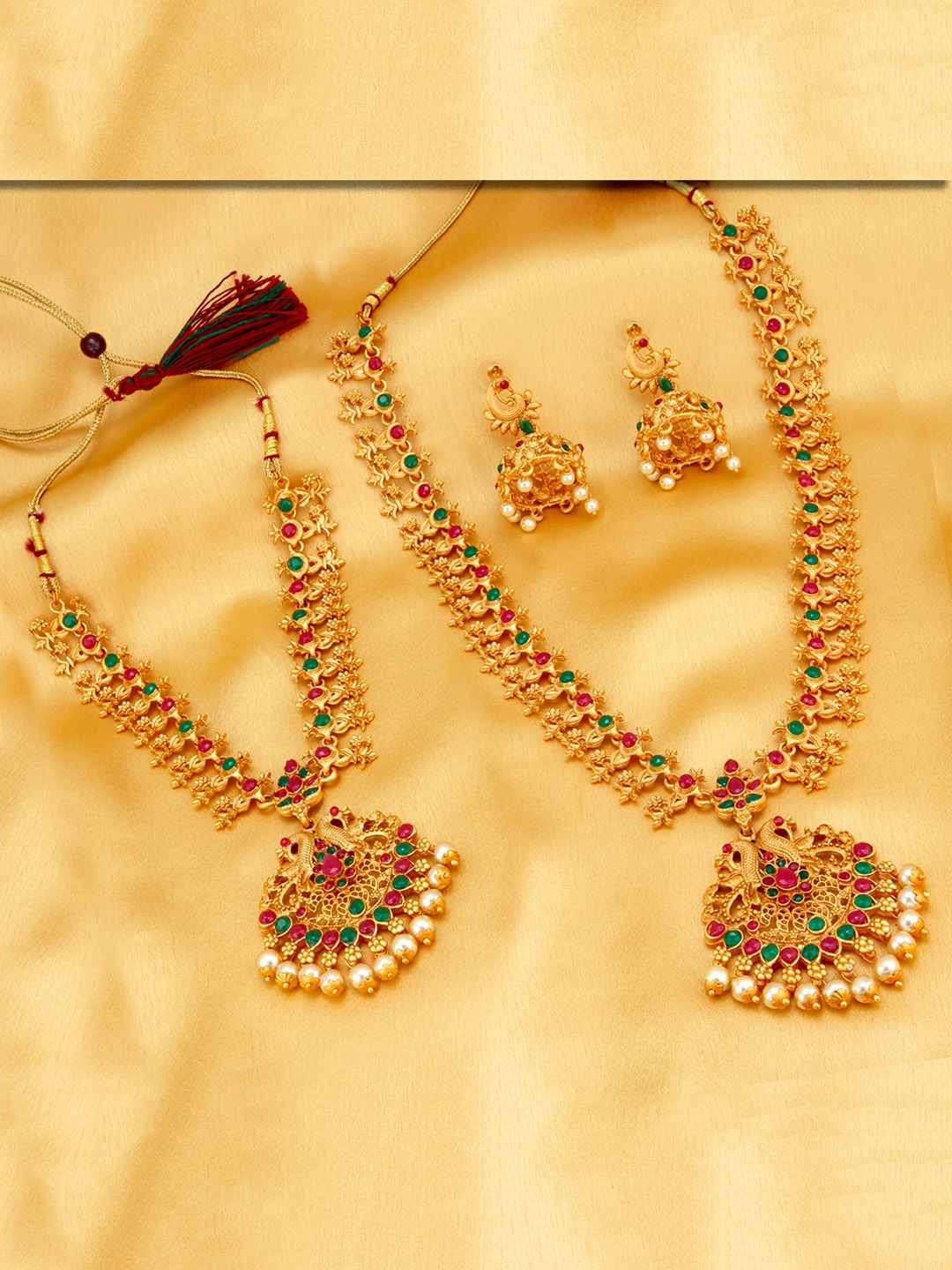 

Sukkhi Gold-Plated Magenta Pink & Green Stone-Studded Pearl Embellished Jewellery Set
