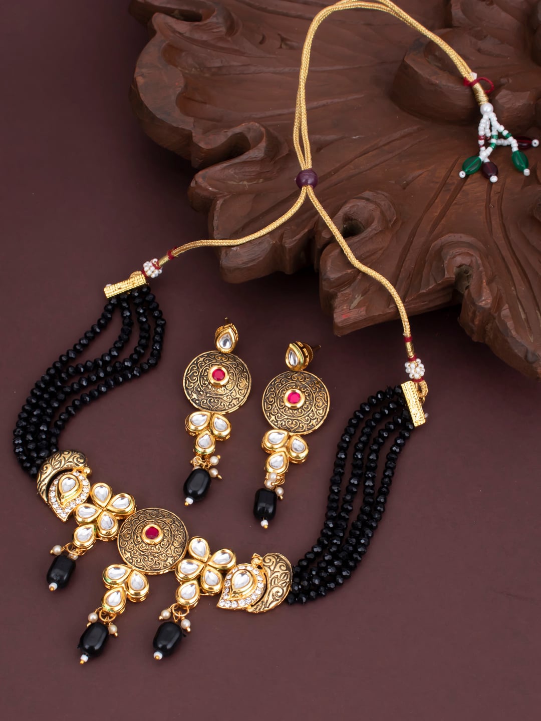 

Sukkhi Gold-Plated Black & White Kundan-Studded & Beaded Sustainable Jewellery Set