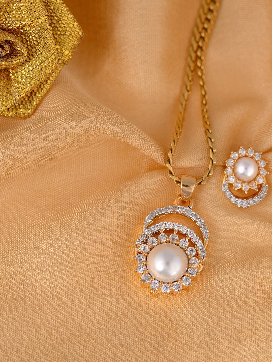 

Saraf RS Jewellery Gold-Plated & White Lightweight American Diamond and Pearl-Studded Jewellery Set