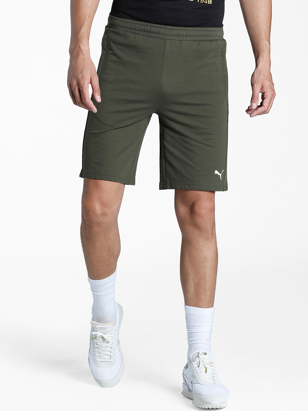 

Puma Men Olive Green Solid Regular Fit Sports Shorts