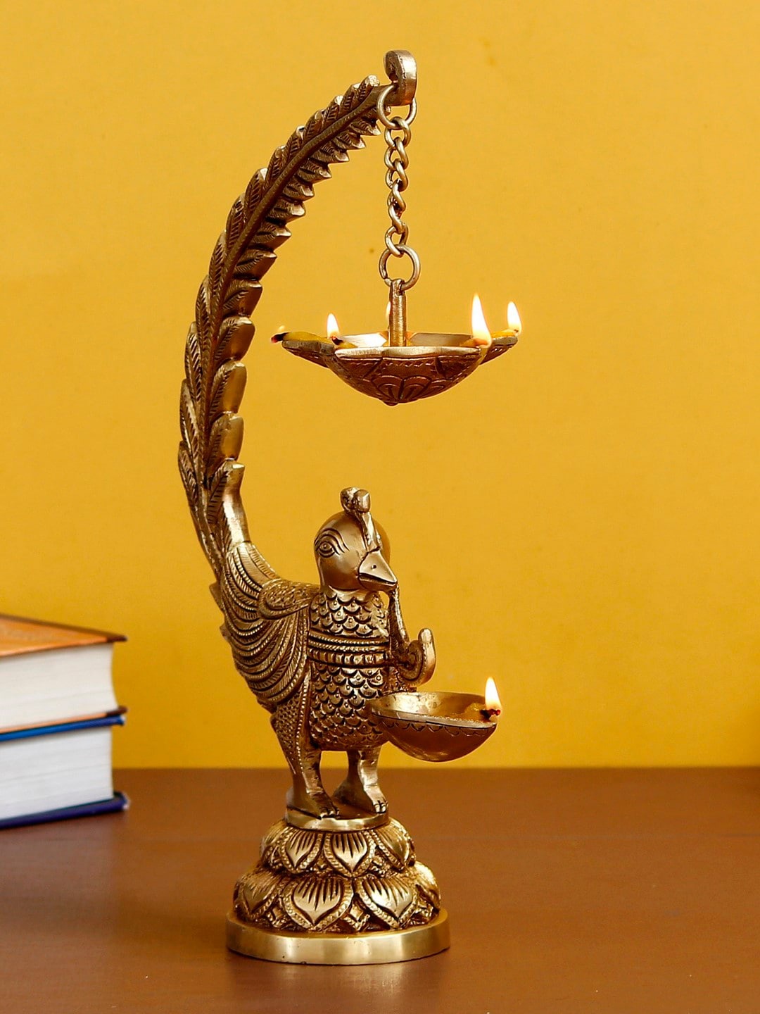 

eCraftIndia Antique Gold-Toned Engraved Peacock With Diya