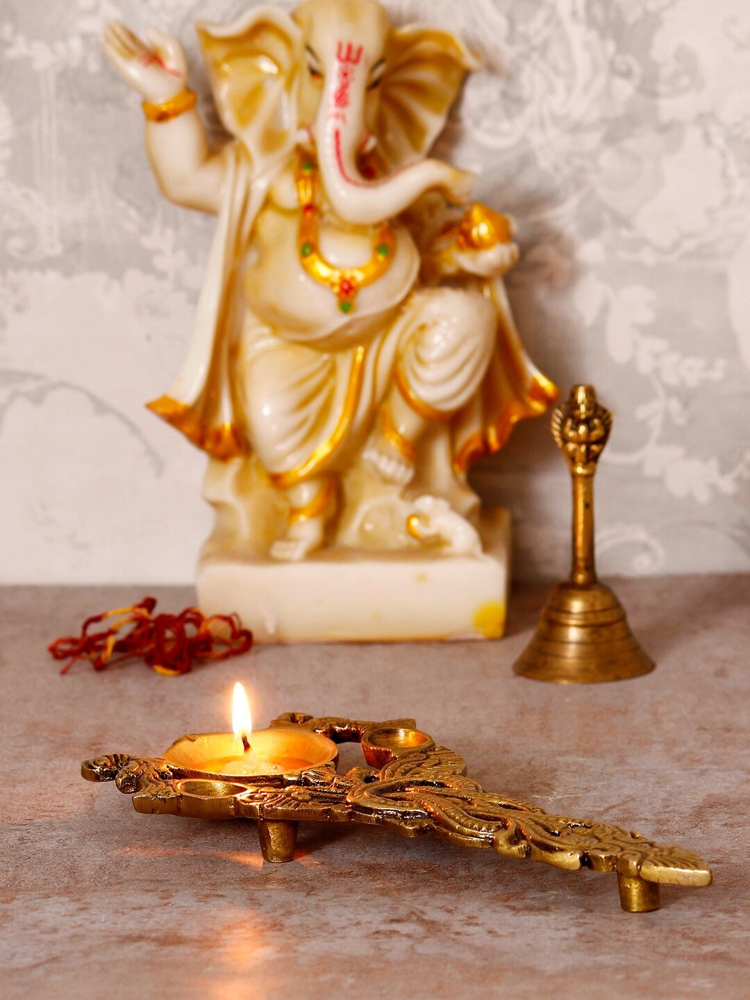 

eCraftIndia Gold-Toned Ethnic Carved Diya For Pooja