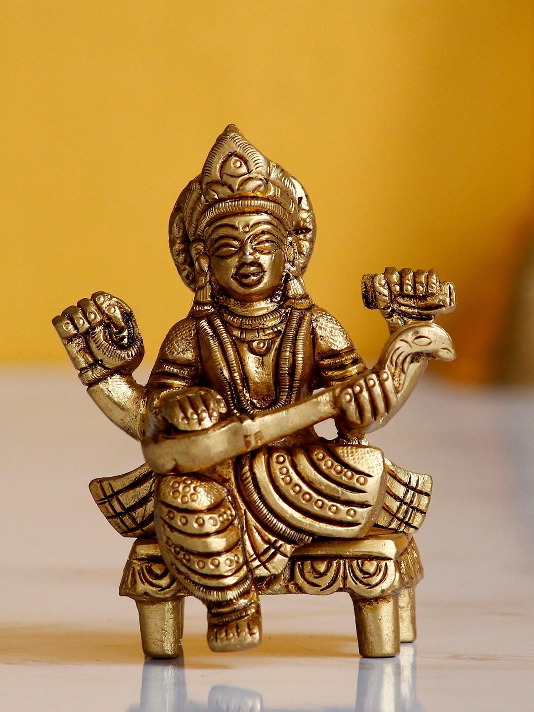 

eCraftIndia Antique Gold-Toned Goddess Saraswati On Chowki Handcrafted Showpiece
