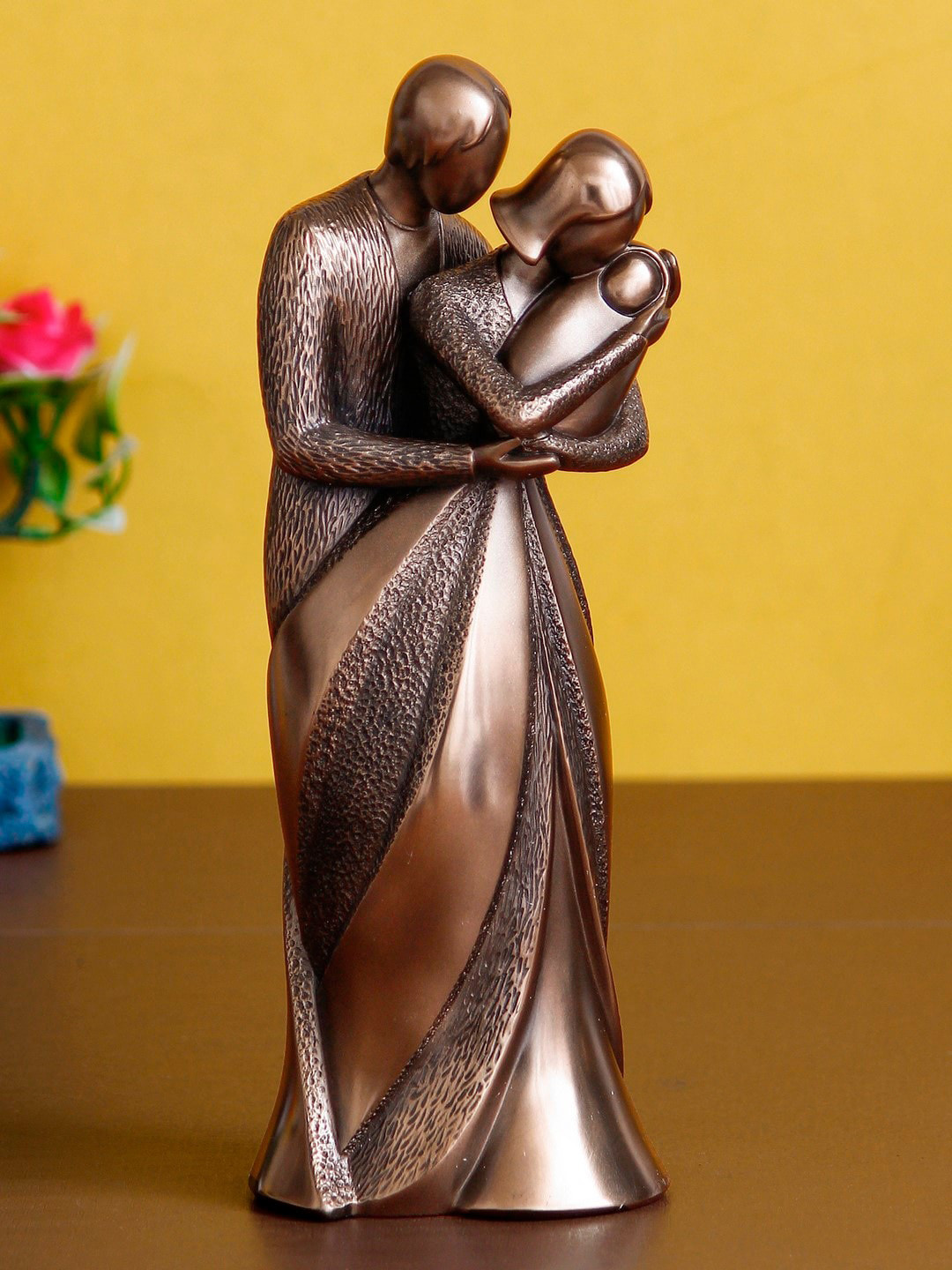 

eCraftIndia Brown Textured Family of Husband Wife & Kid Decorative Showpiece