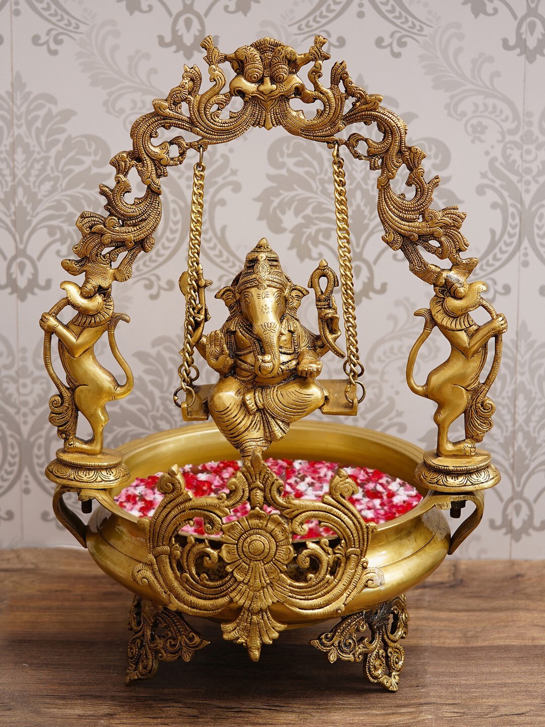 eCraftIndia Gold-Toned Lord Ganesha On Swing Handmade Brass Urli
