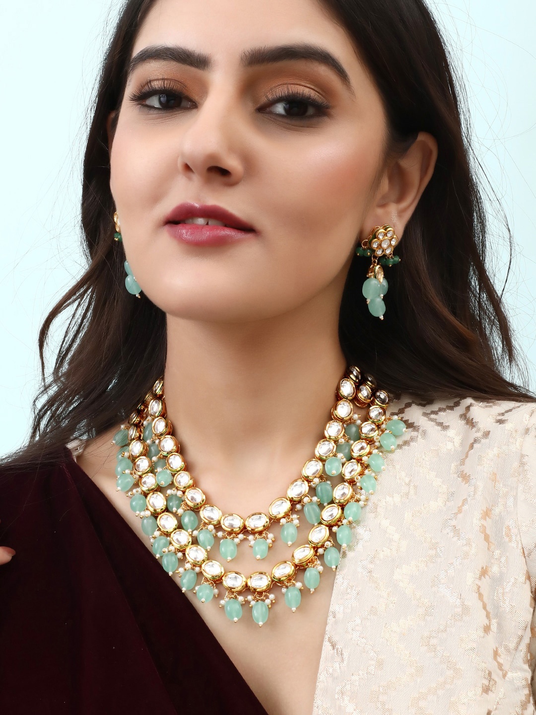 

Rubans 24K Gold-Plated Green & White Kundan Studded Jewellery Set
