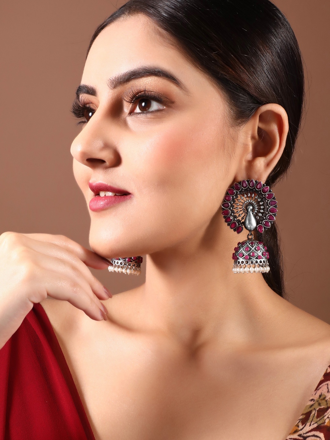 

Rubans Silver-Toned Ruby Studded Peacock Shaped Jhumkas