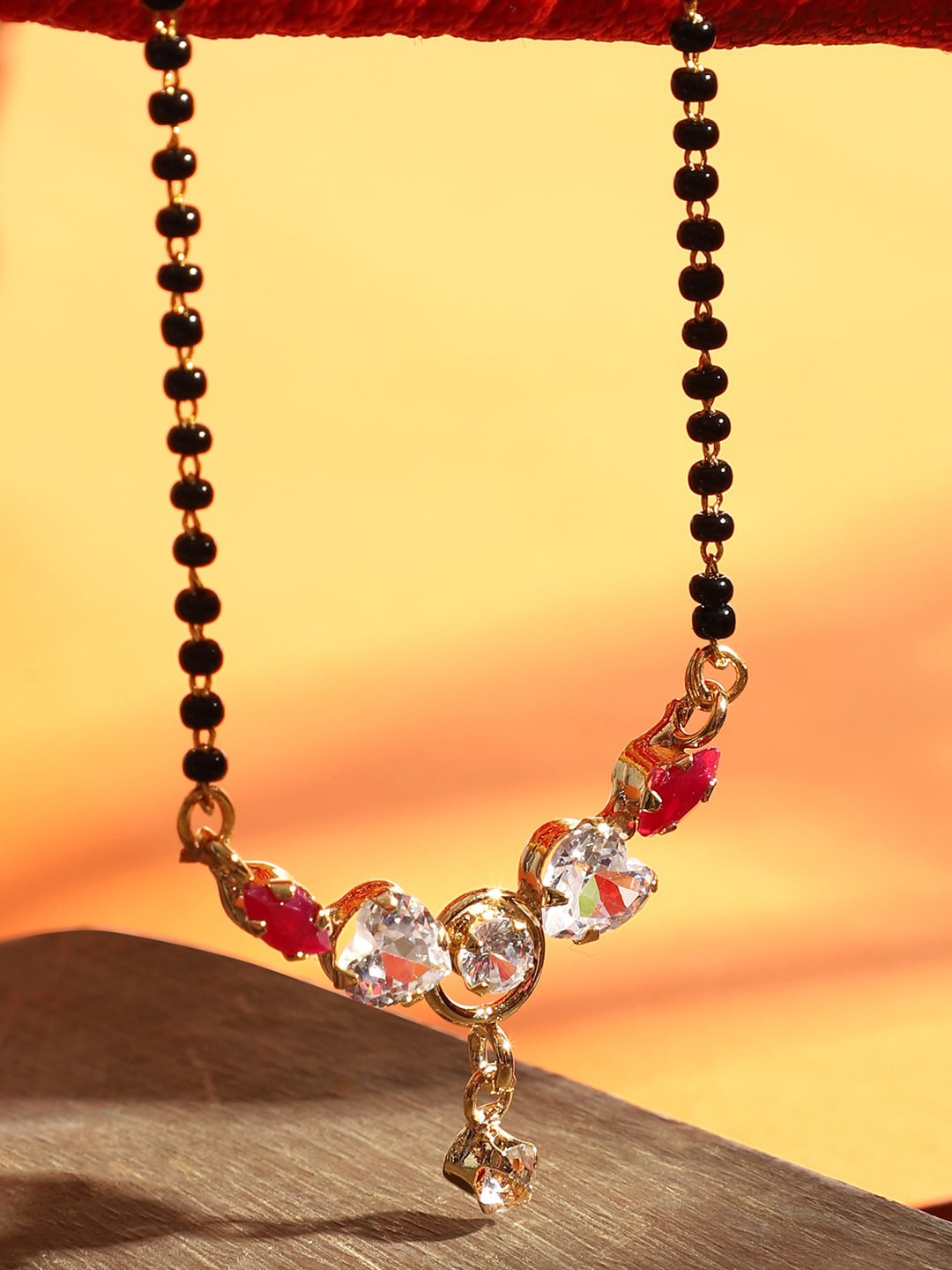 

ANIKAS CREATION Gold-Plated Black & White AD-Studded Beaded Traditional Mangalsutra