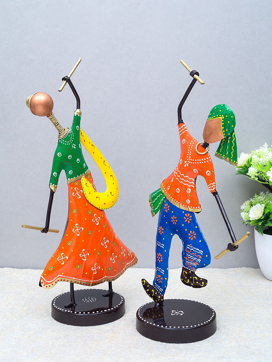 

Golden Peacock Set Of 2 Orange & Green Handcrafted Garba Playing Gujarati Couple