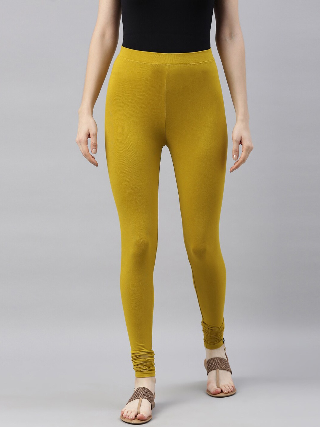 

TWIN BIRDS Women Mustard Yellow Solid Churidar-Length Leggings