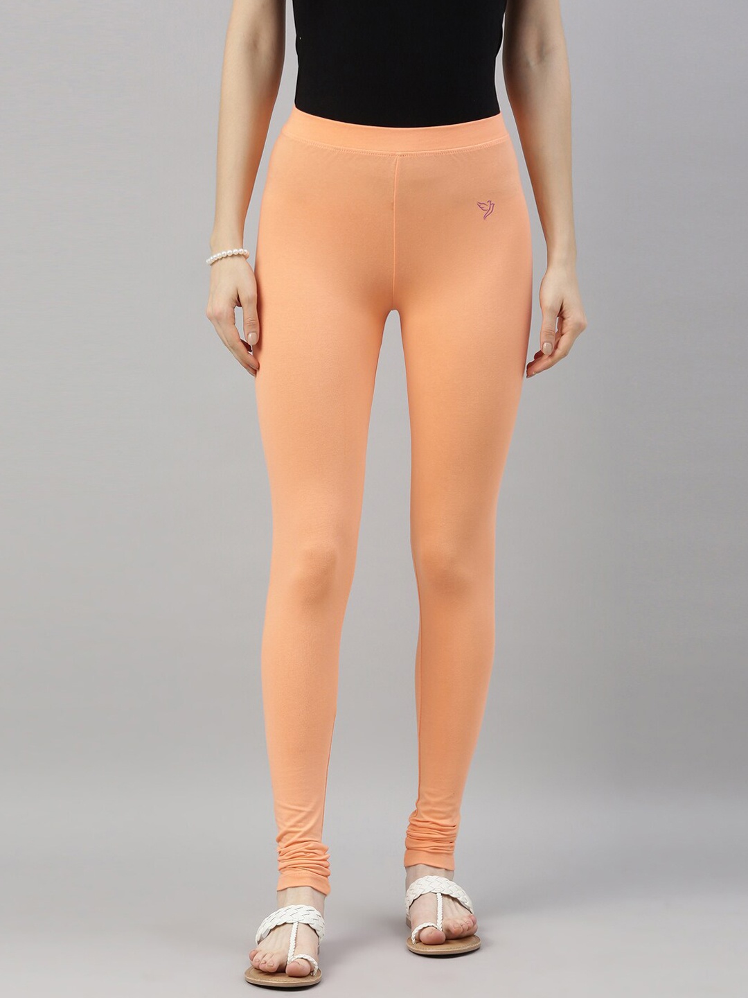 

TWIN BIRDS Women Peach-Coloured Solid Churidar-Length Leggings