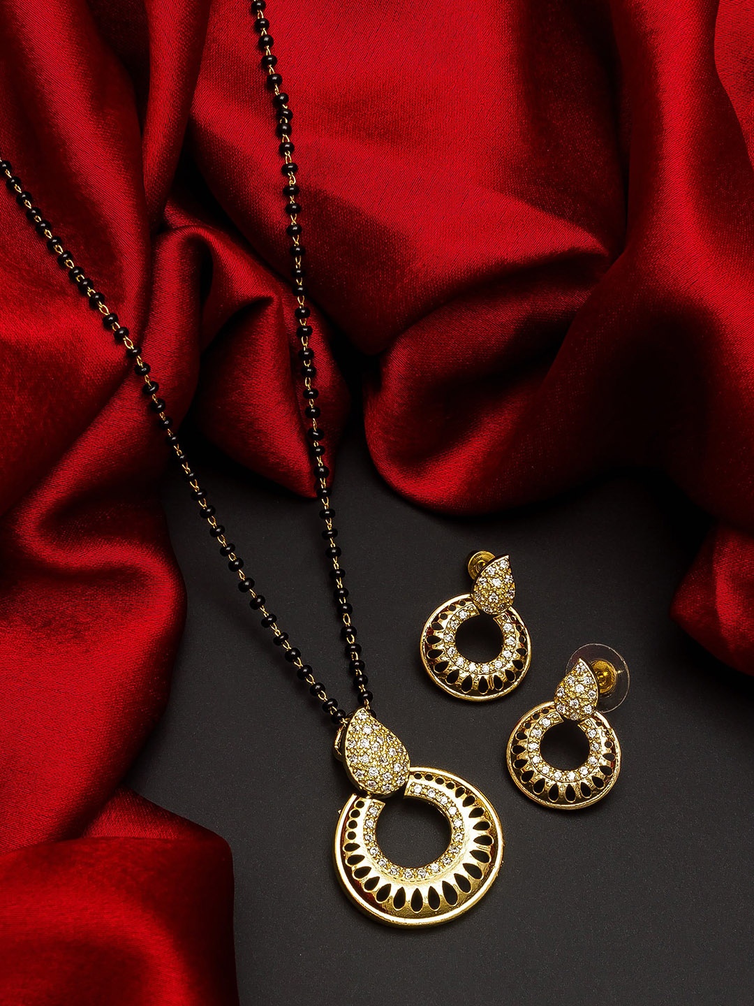 

aadita Gold-Plated Black & White AD-Studded Mangalsutra With Earrings