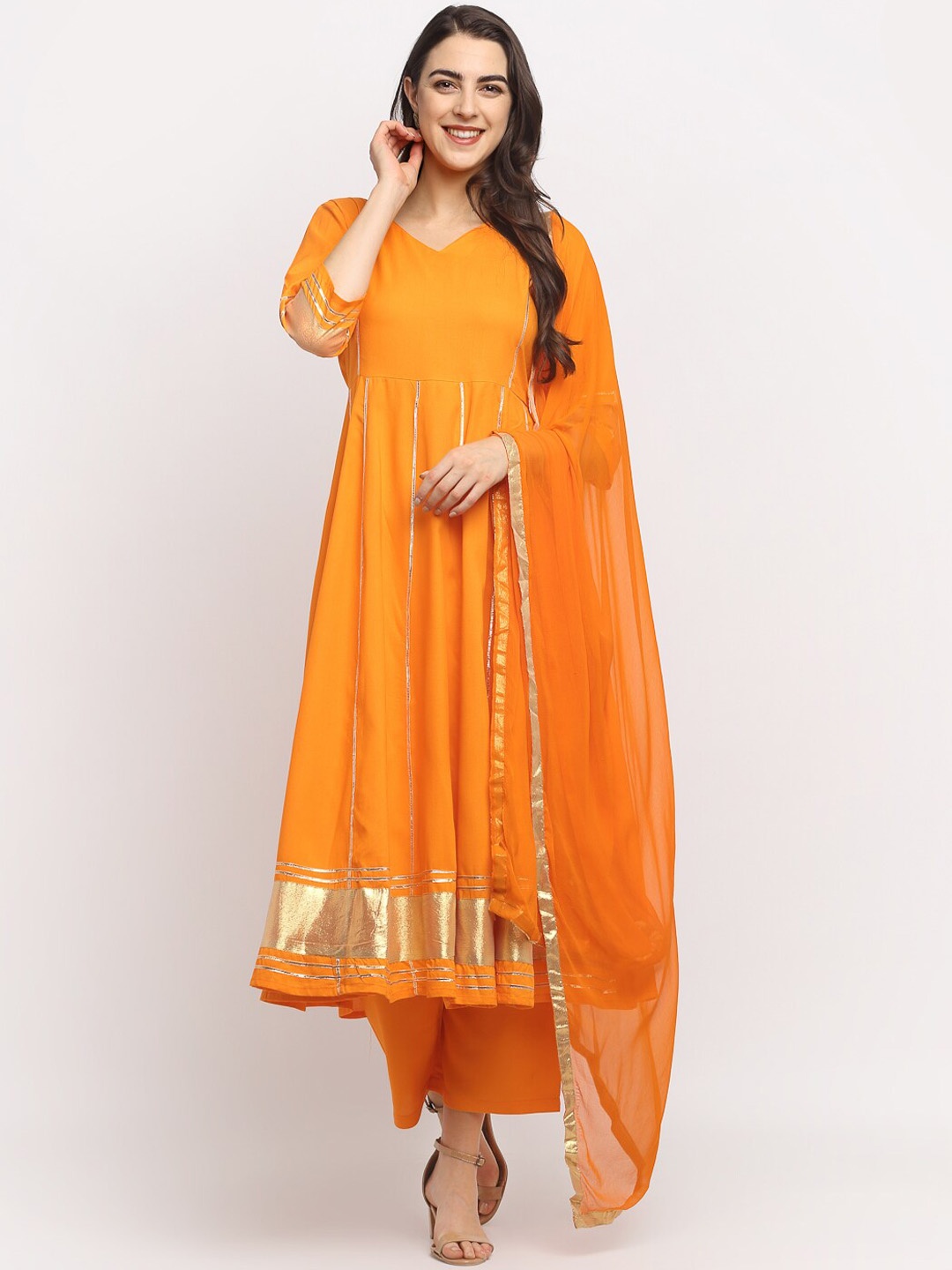

Rudra Bazaar Women Orange Solid Kurta with Palazzos & Dupatta