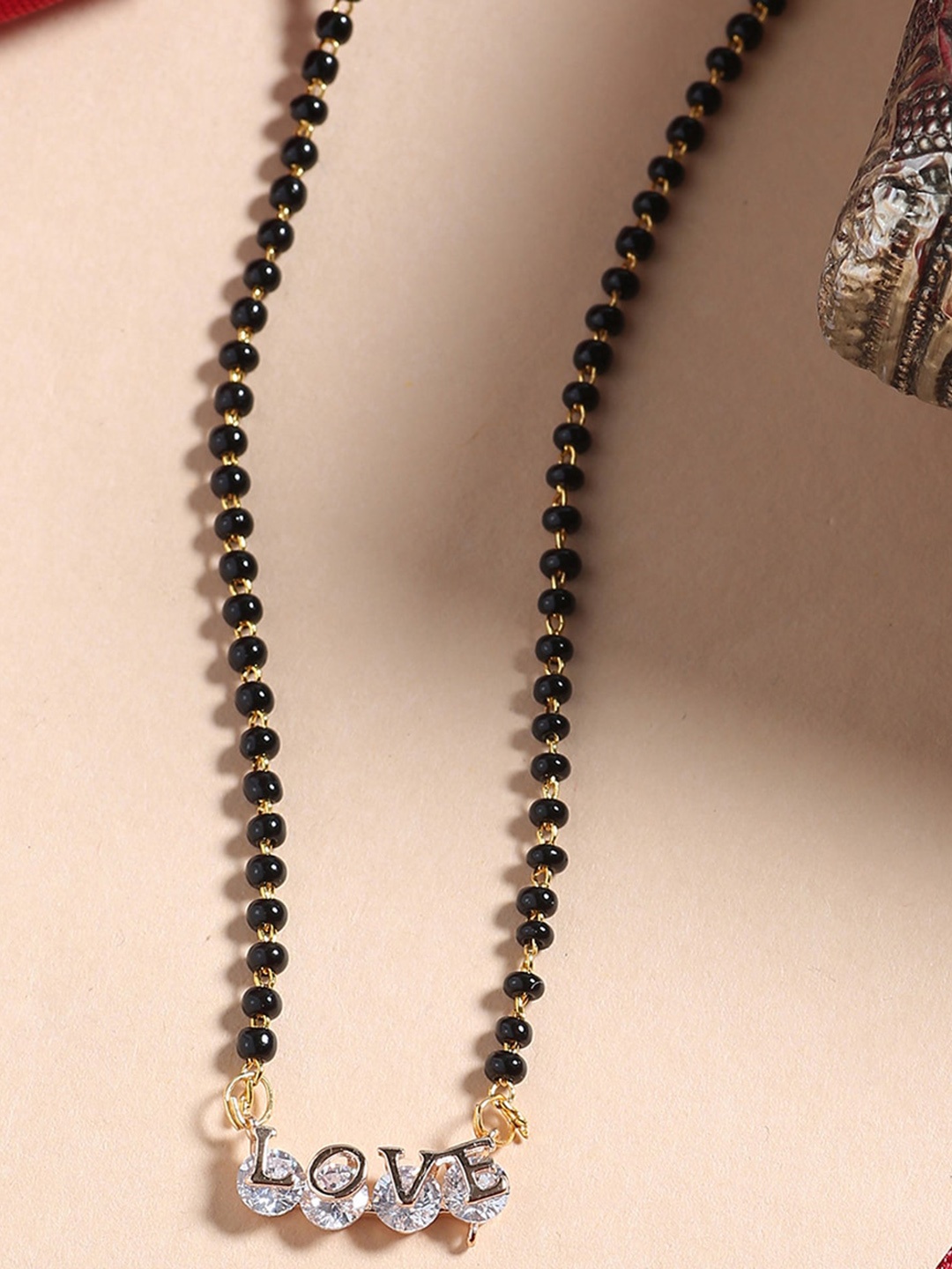 

Shoshaa Black Gold-Plated Stone-Studded & Beaded Love Shaped Mangalsutra