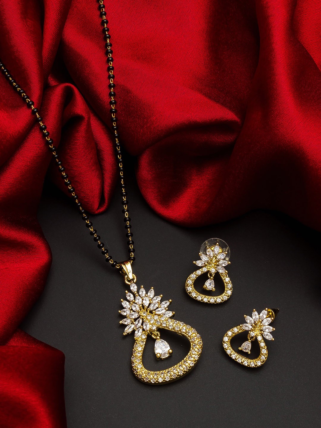 

aadita Gold-Plated Black Beaded White Stone-Studded Mangalsutra With Earrings