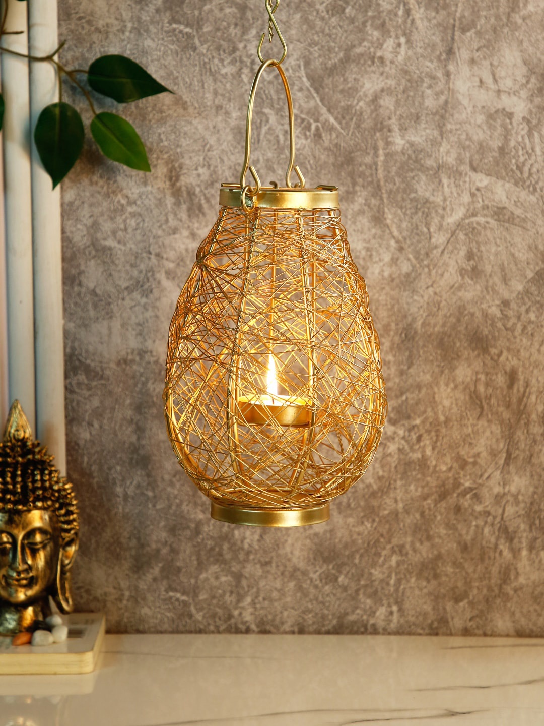 

CraftVatika Gold-Toned Hanging Bird Nest Lantern Candle Holder Showpiece