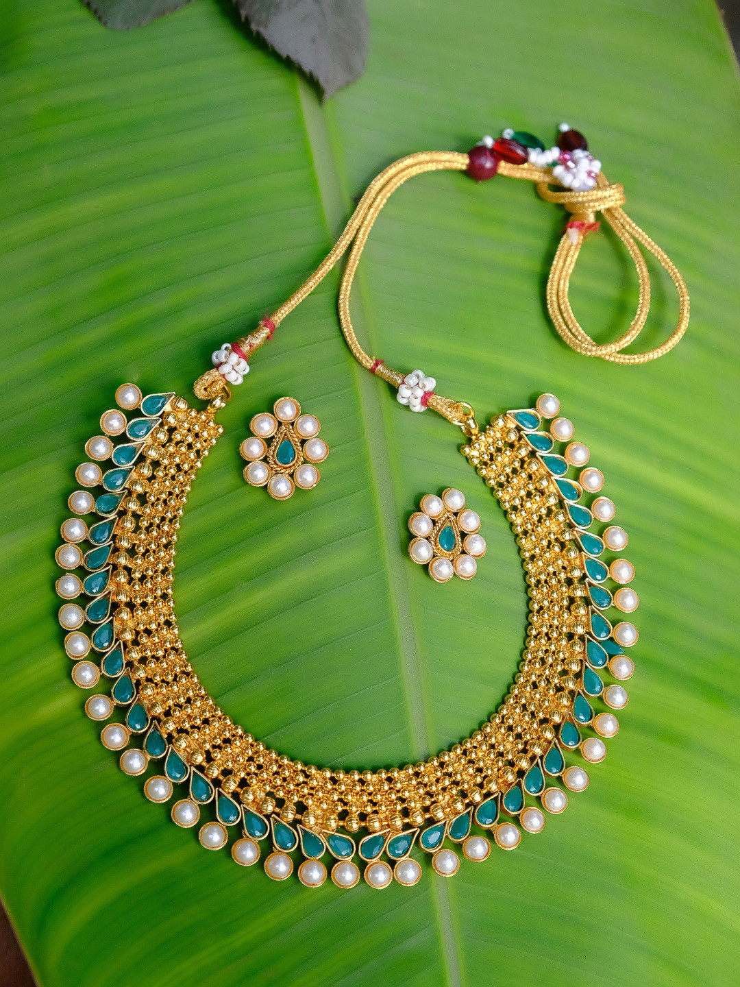

Crunchy Fashion Sea Green & Off-White Gold-Plated Stone-Studded & Beaded Jewellery Set