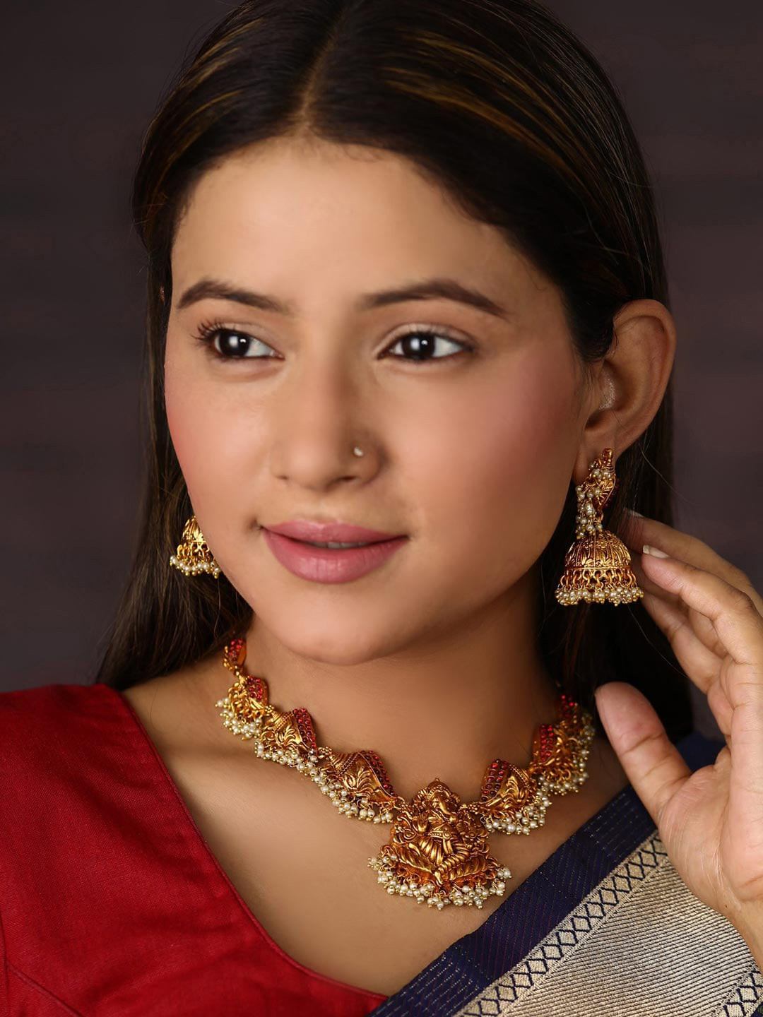 

Priyaasi Pink Gold-Plated Stone-Studded & Beaded Handcrafted Temple Jewellery Set