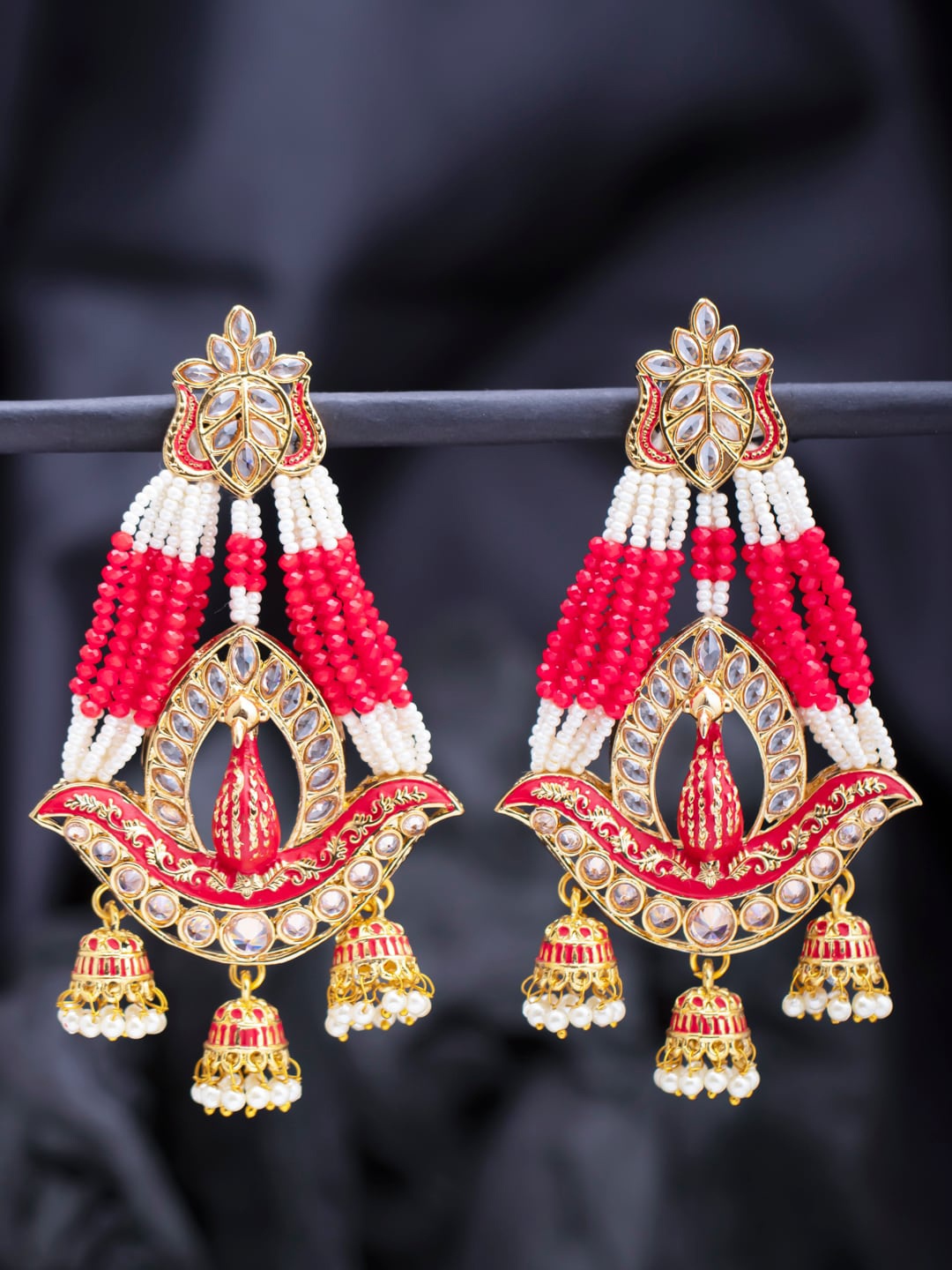 

Sukkhi Pink & White Peacock Shaped Drop Earrings