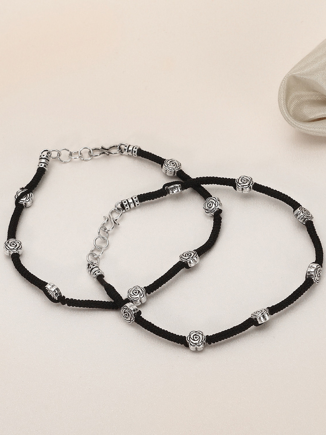 

Adwitiya Collection Set of 2 Silver-Plated Black Thread Handcrafted Flower Anklets